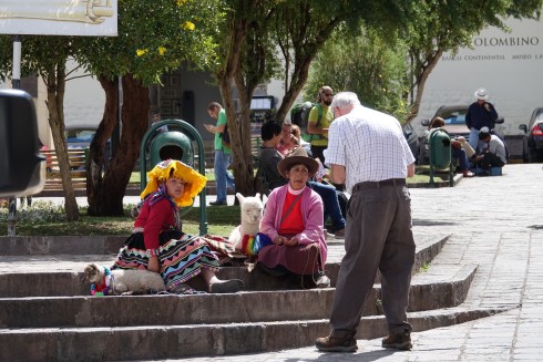 Bill taking a picture of a traditional Inca woman and her daughter in traditional dress, and their Alpaca