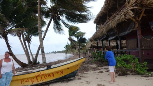 Falling coconuts can kill a person! Katie checking our Capricorn's boat